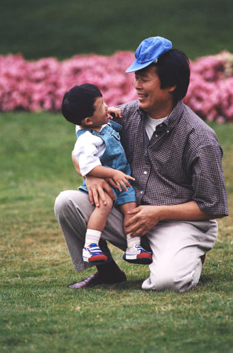 Father and child playing